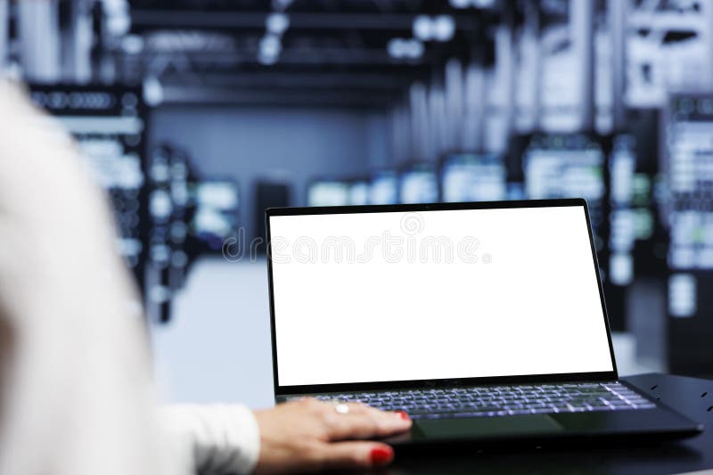 Specialist using laptop in data center. Close up shot of mock up laptop used by specialist in server hub delivering massive computing power, capable of processing and storing large amounts of data and controlling network resources