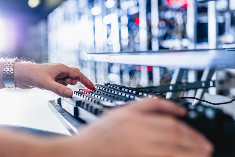 IT specialist working in bitcoin and crypto currency mining farm royalty free stock photography
