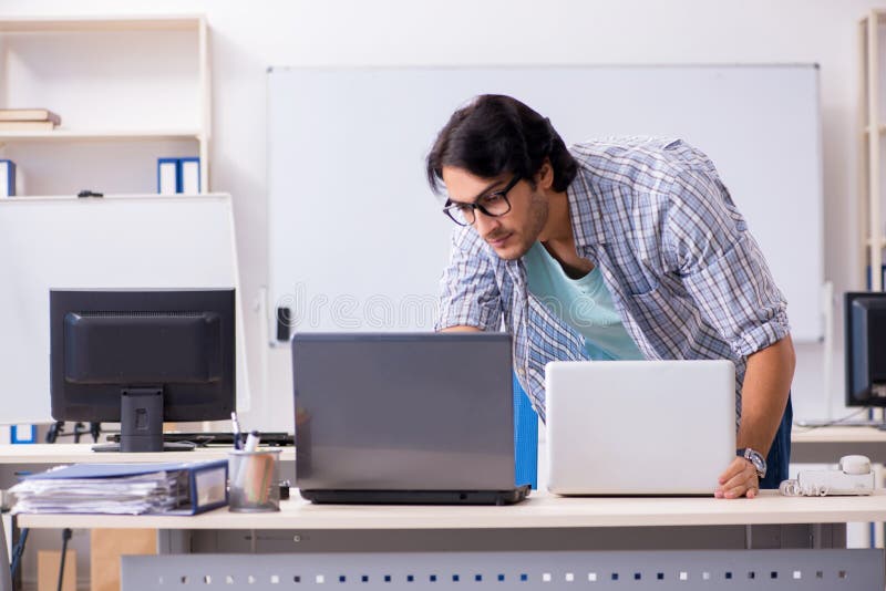 The it specialist working in the office stock photos