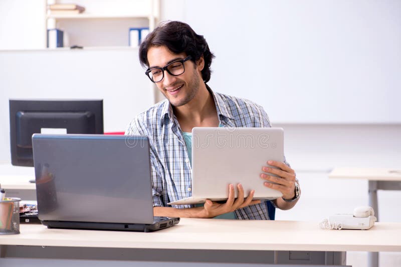 The it specialist working in the office royalty free stock photography