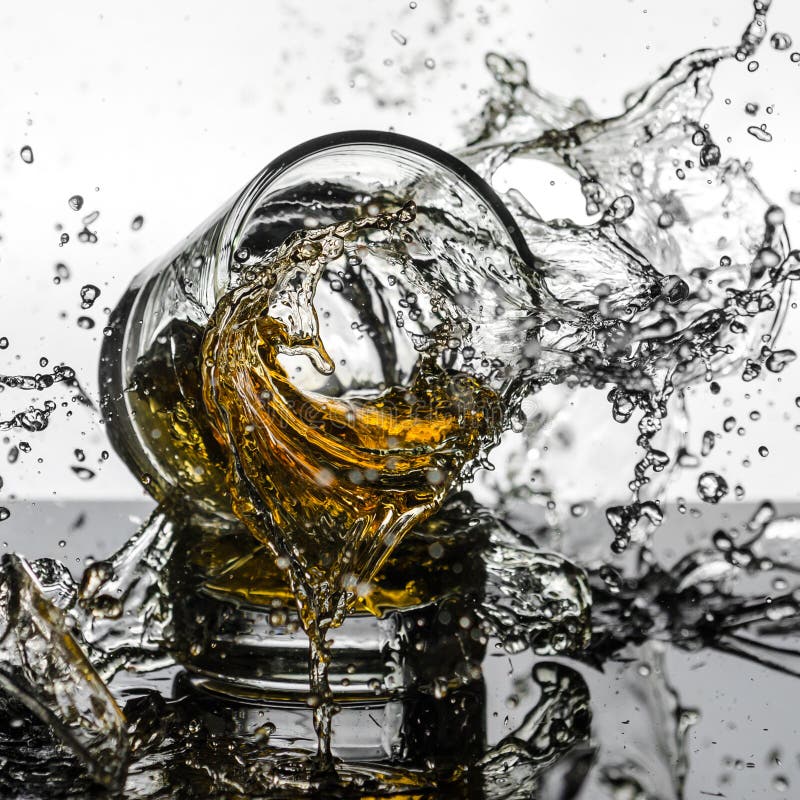 Spectacular High Speed shot of whiskey Glasees breaking royalty free stock image Spectacular High Speed shot of whiskey Glasees breaking royalty free stock image