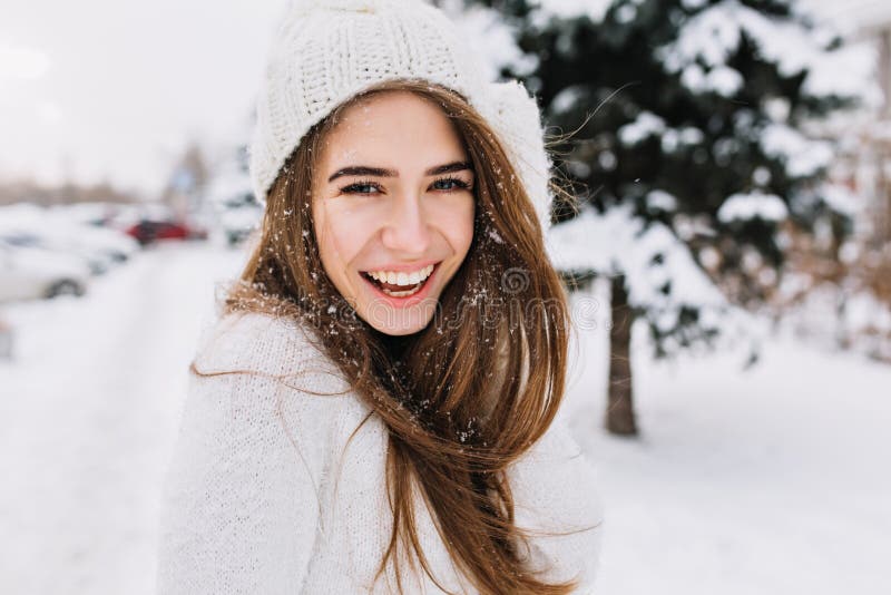Spectacular Long-haired Woman Laughing while Posing on Snow Background ...