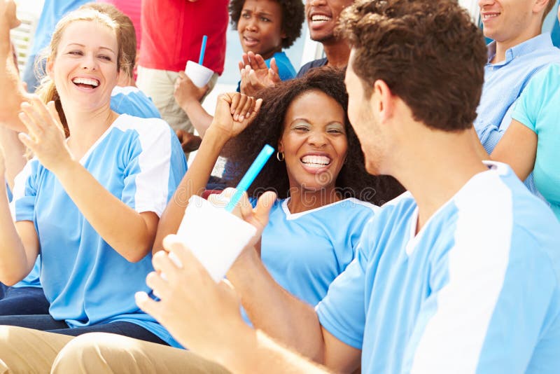 Spectators In Team Colors Watching Sports Event