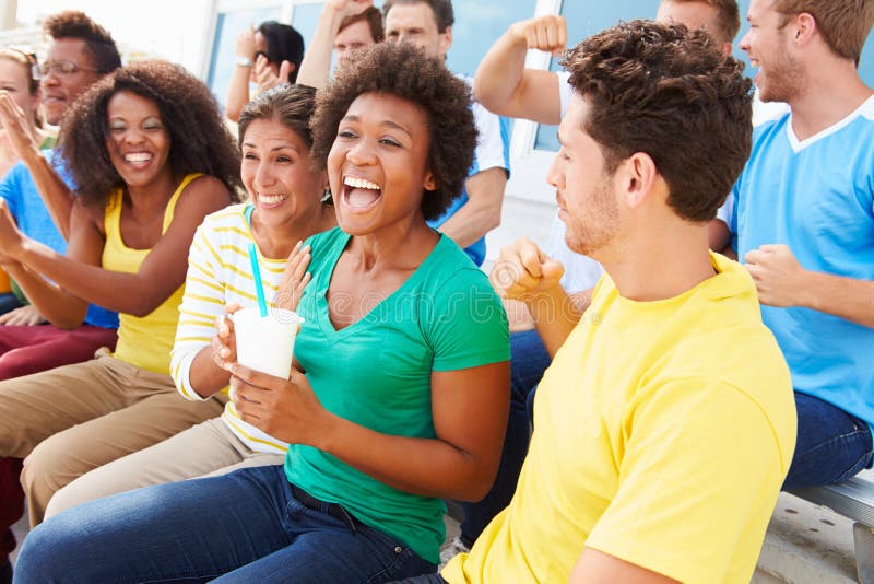 Spectators In Team Colors Watching Sports Event