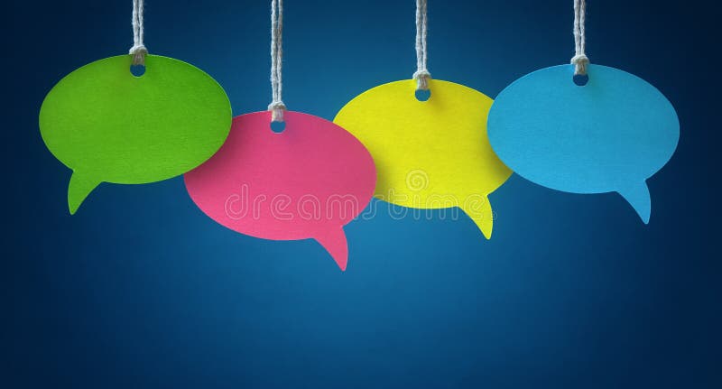 Blank colorful speech bubbles hanging from a cord over blue background