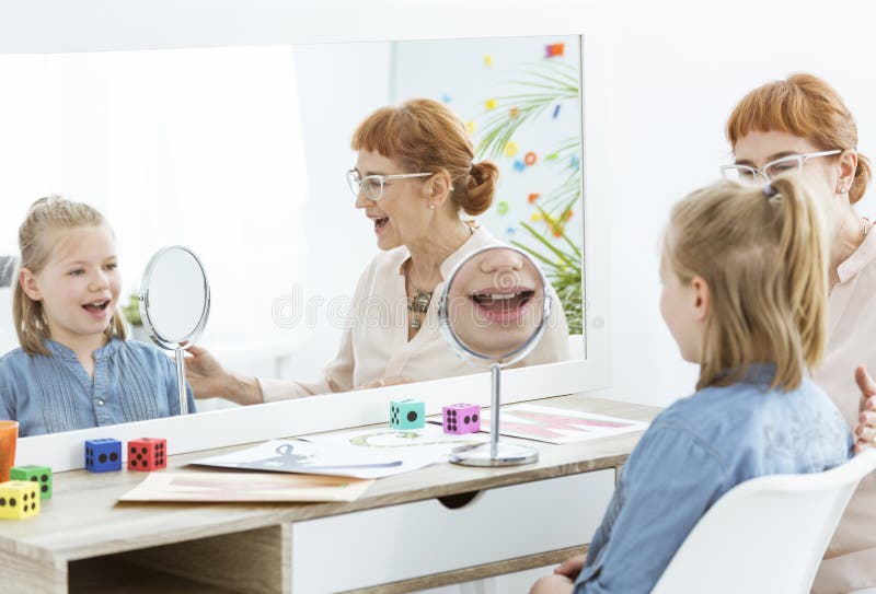 Speech Therapist Using Mirror Exercises Stock Photo Image of learning