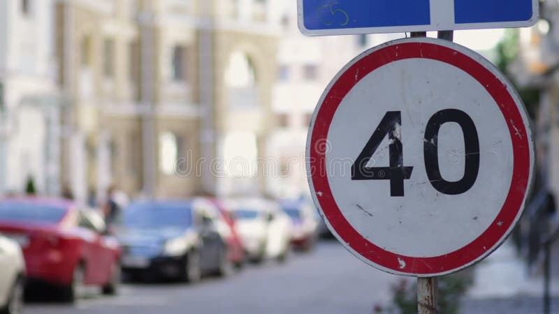 Speed limit sign in the city street on summer day