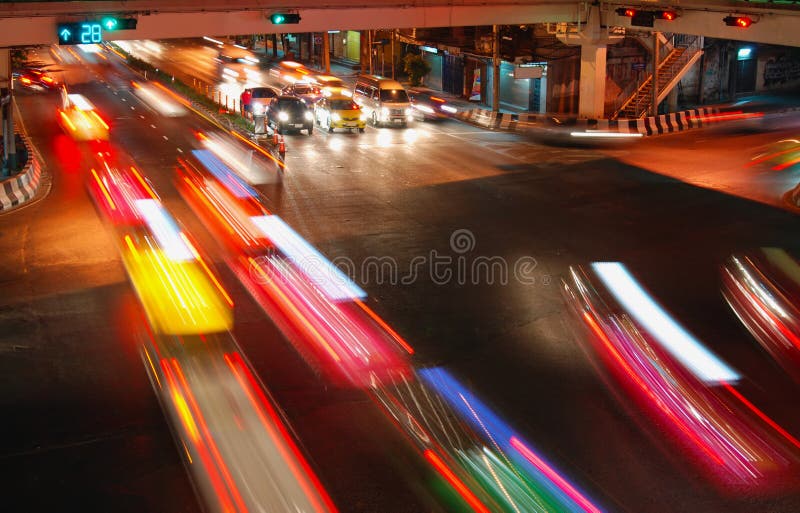 Night speed traffic car light trail at street junction of Bangkok City