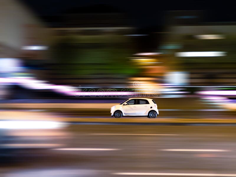 Speeding car driving on a highway with motion blur