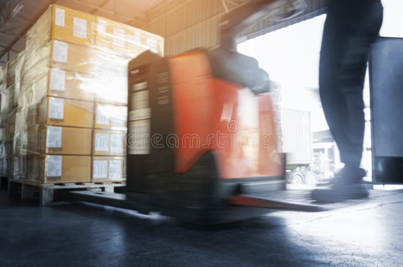 Speeding Motion of Worker Driving Electric Forklift to Unloading Package Boxes at the Warehous