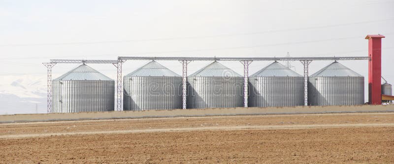 Metal modern farm storage silos. Metal modern farm storage silos