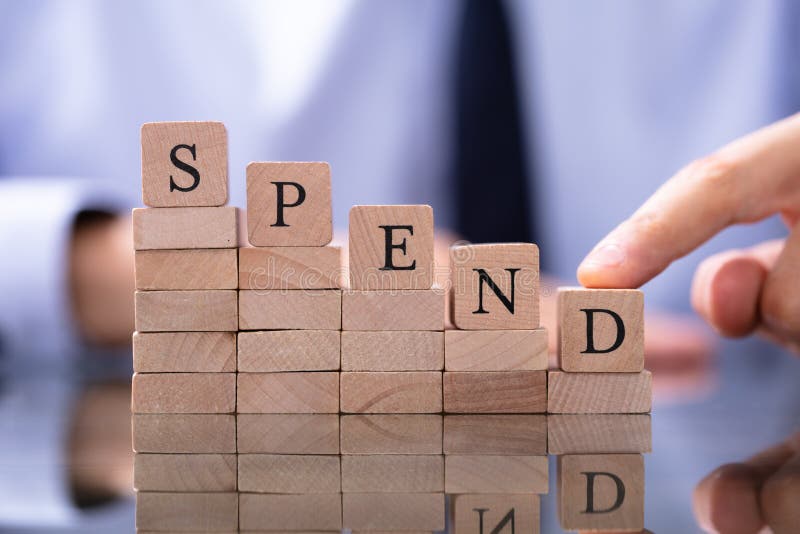 Spend Word with Declining Chart on Desk Stock Image Image of closeup