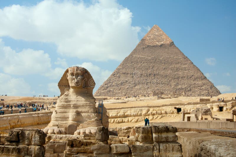 The Sphynx and Pyramid under blue sky