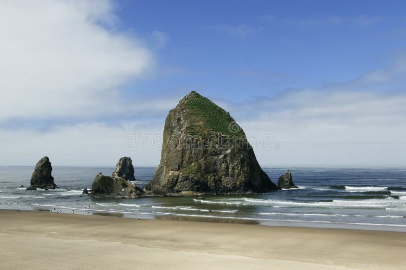 Cannon Beach, Oregon is a nine-mile wide sandy beach that features Haystack Rock, the third largest coastal monolith in the world, at 235 feet high (see similar photos below). Haystack Rock has been designated as a marine and bird sanctuary. The tidepools around the rock have many intertidal animals in them, including limpets, barnacles, starfish, crabs, sea sculpins and anemones. Several bird species nest on the rock in the summer. The most colorful of these is the Tufted Puffin. Cannon Beach, Oregon is a nine-mile wide sandy beach that features Haystack Rock, the third largest coastal monolith in the world, at 235 feet high (see similar photos below). Haystack Rock has been designated as a marine and bird sanctuary. The tidepools around the rock have many intertidal animals in them, including limpets, barnacles, starfish, crabs, sea sculpins and anemones. Several bird species nest on the rock in the summer. The most colorful of these is the Tufted Puffin.