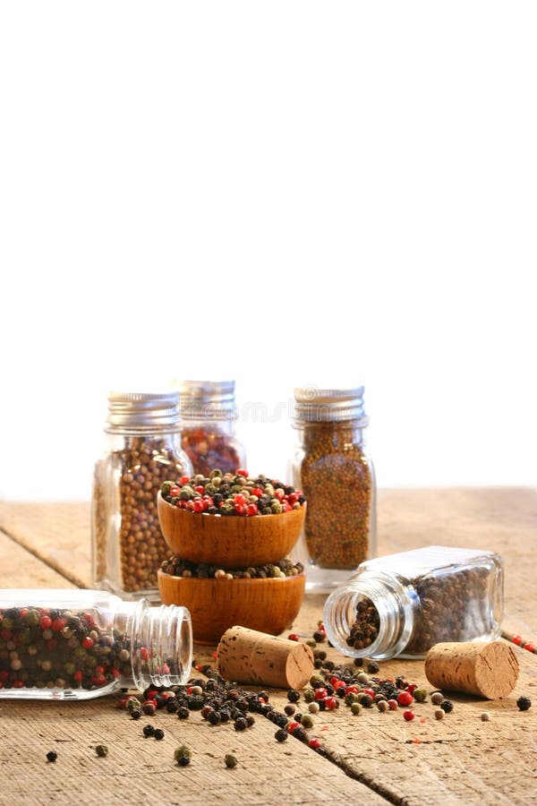 Spice bottles on rustic table