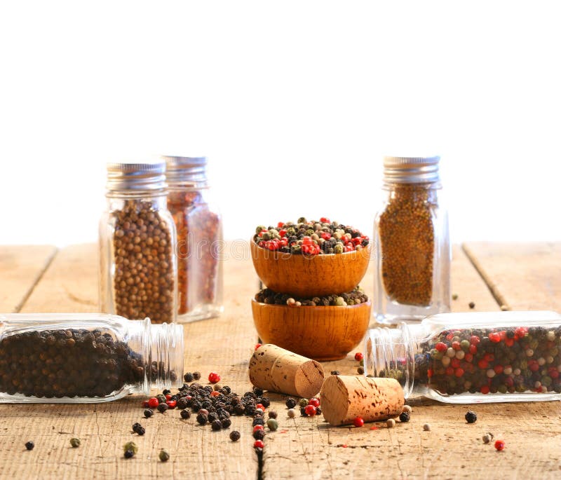 Spice glass containers on old wood table