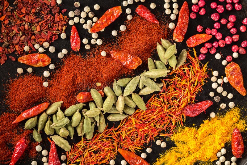 Spice and herbs selection on black background