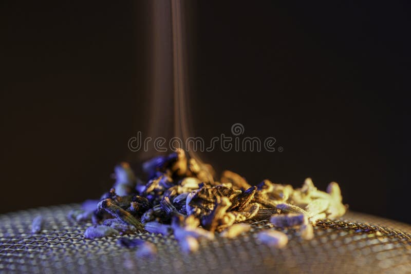 Spice for Smoking on a Fine Wire Grid Glows, Smokes Stock Image Image