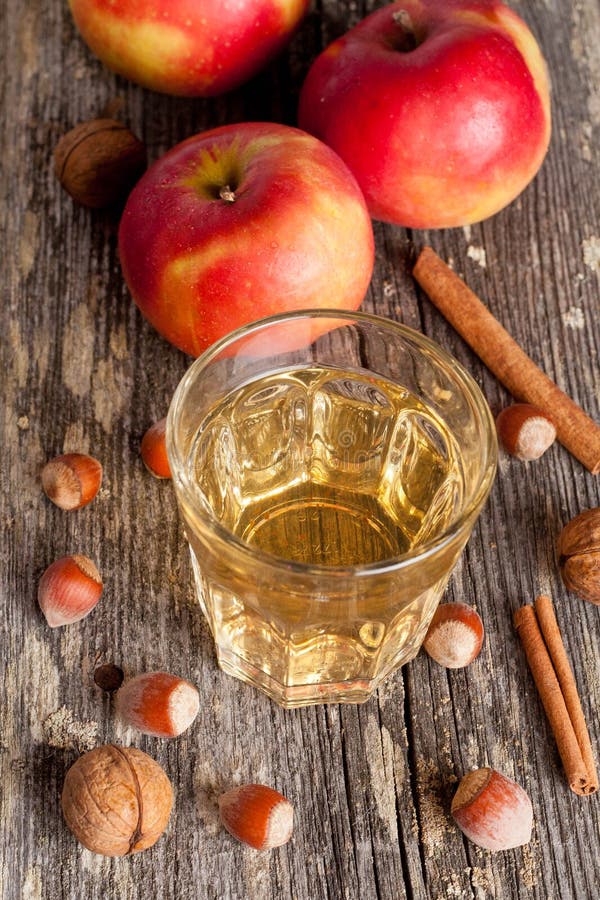 Spiced Apple Cider and Spices on a Wooden Table, Closeup Stock Photo