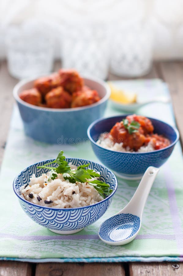 Spiced Rice with Fish Meatballs in Tomato Sauce Stock Photo - Image of