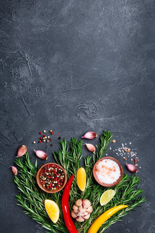 Spices and herbs on black stone table top view. Ingredients for cooking. Food background. Spices and herbs on black stone table from above. Ingredients for stock photos Spices and herbs on black stone table top view. Ingredients for cooking. Food background. Spices and herbs on black stone table from above. Ingredients for stock photos