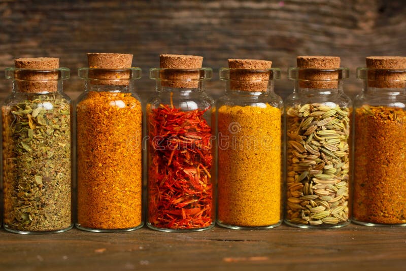 Spices, herbs and seeds stock image. Image of curry, container 37383857