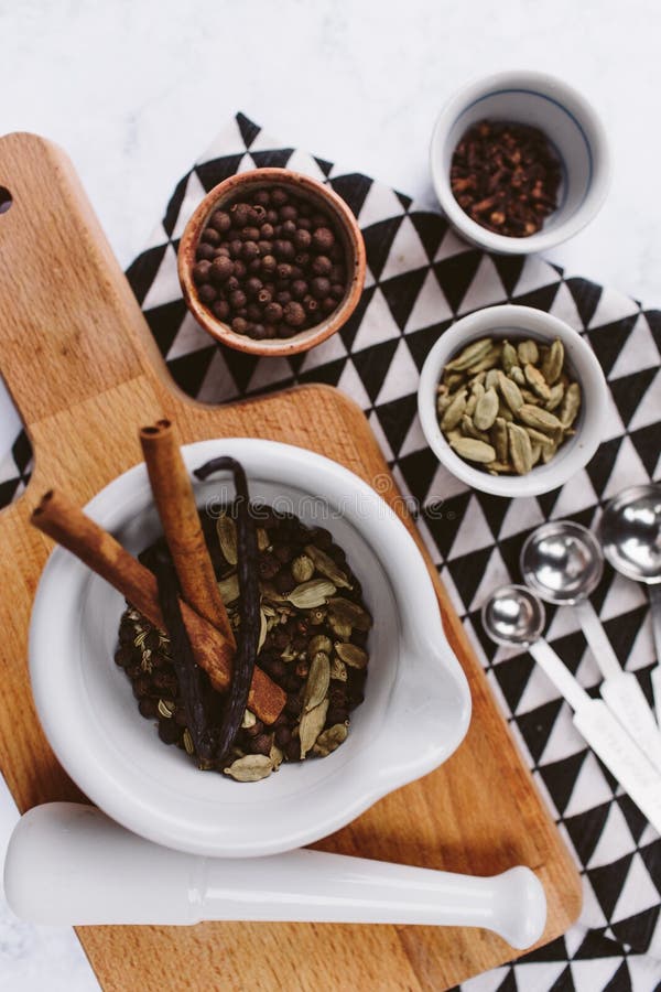 Set of Spices and Mortar with a Pestle Isolated on White Background