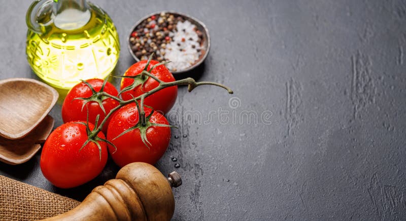 Spices, olive oil, and utensils on cooking table stock photos