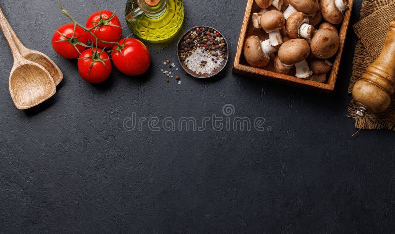 Spices, olive oil, and utensils on cooking table stock images