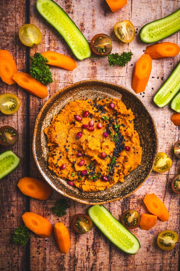 Spicy carrot hummus with raw vegetable sticks. Paleo cauliflower stock images, royalty-free photos and pictures