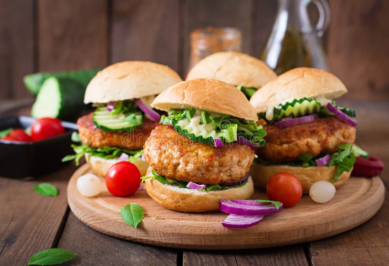 Spicy chicken burgers with tomato and eggplant - sandwich. stock photo Spicy chicken burgers with tomato and eggplant - sandwich. stock photo
