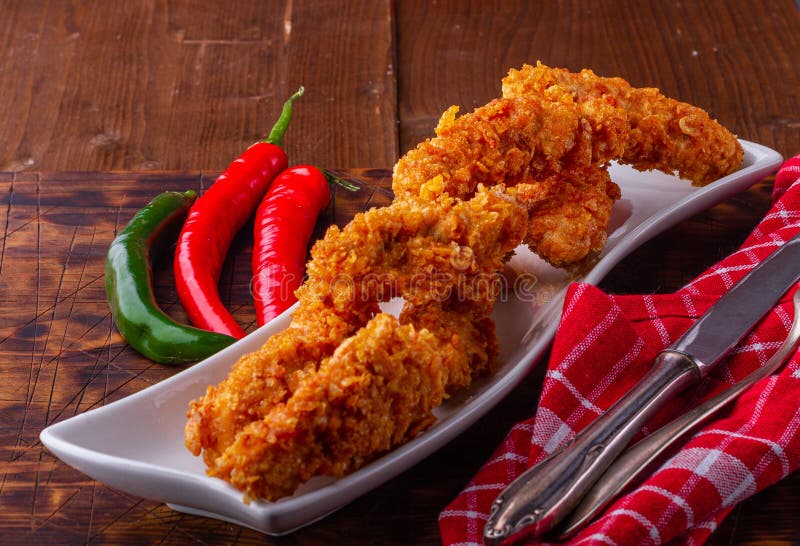 Spicy chicken strips. Chicken cutlets. Crunchy breadcrumbs. Fast food. Tasty chicken. Family picnic. royalty free stock photos Spicy chicken strips. Chicken cutlets. Crunchy breadcrumbs. Fast food. Tasty chicken. Family picnic. royalty free stock photos