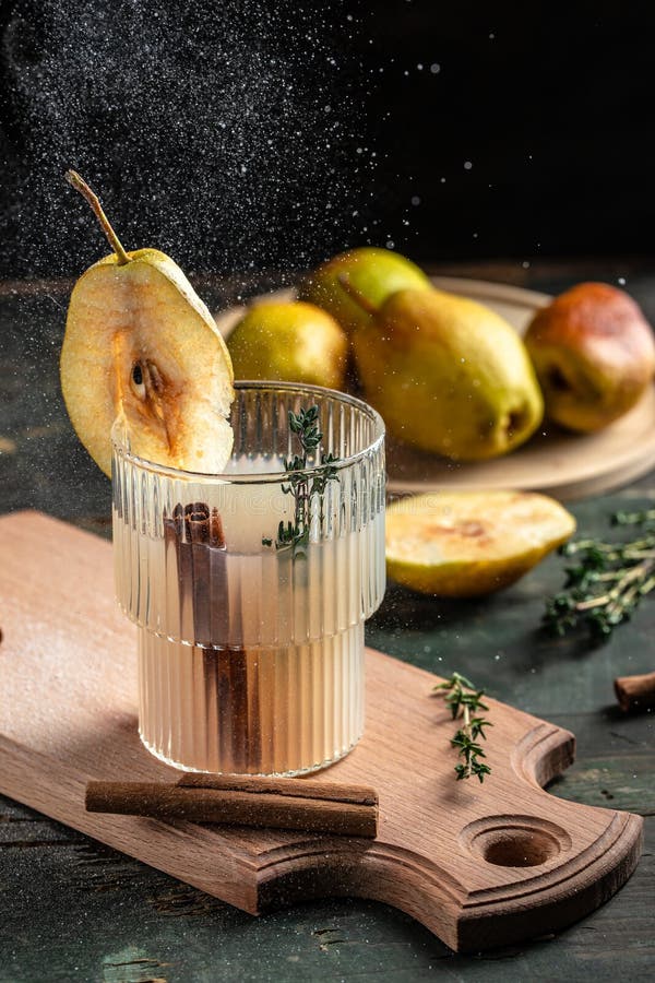 Spicy Cocktail with Pears and Thyme. Mulled Wine. Vertical Image. Top