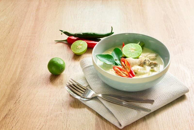 Spicy creamy coconut soup with chicken , Thai food called Tom Kha Gai on the wooden table stock images Spicy creamy coconut soup with chicken , Thai food called Tom Kha Gai on the wooden table stock images