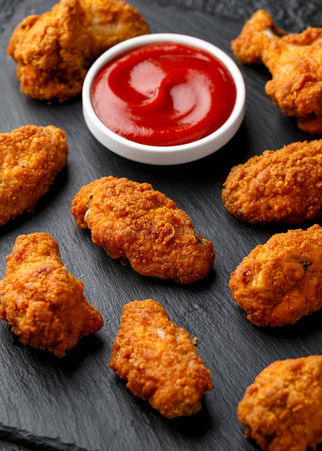 Spicy Deep Fried Chicken Wings with Ketchup on Stone Board Stock Image
