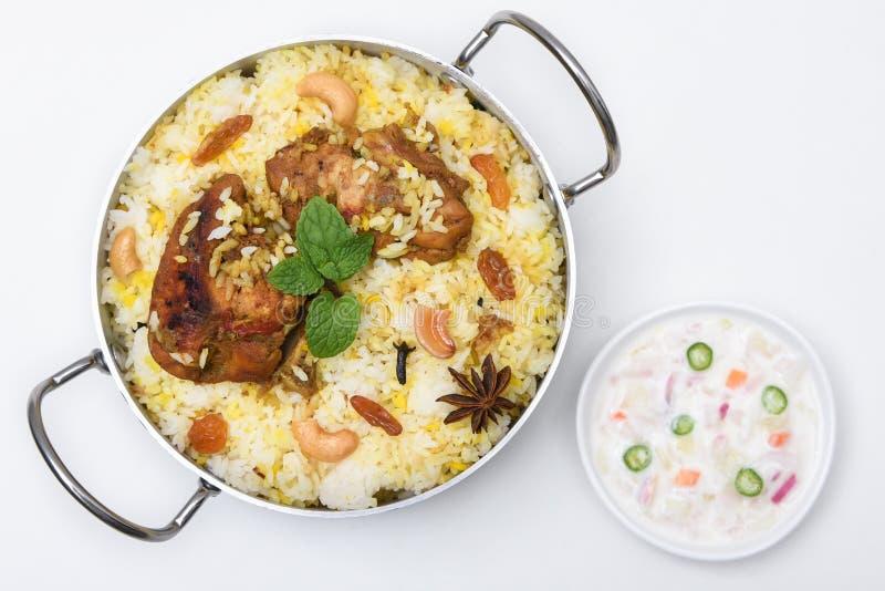 Spicy and delicious chicken biryani in traditional clay pot. Malabar biryani or Hydrabadi chicken biryani, Dum Biriyani, Chicken pulao basmati rice, herbs, raitha for Ramadan Kareem, Eid-Ul-Adha. Chicken dum biryani stock images, royalty-free photos and pictures
