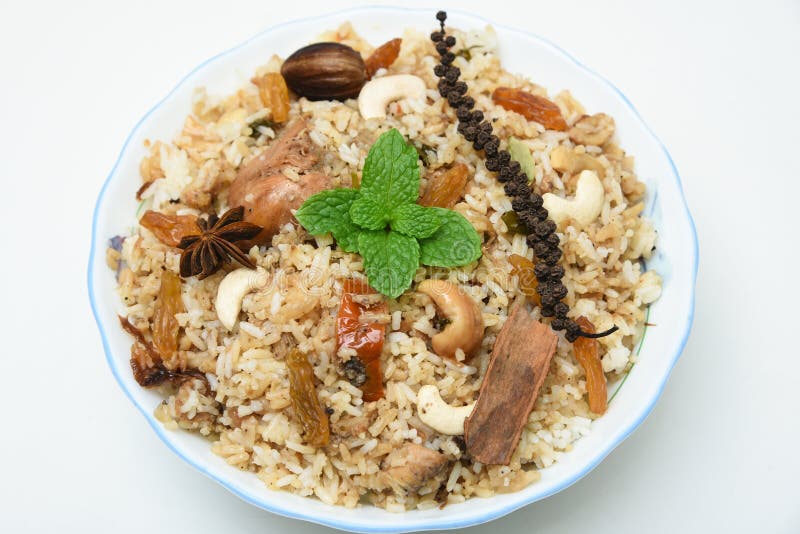 Spicy and delicious chicken biryani in traditional clay pot. Malabar biryani or Hydrabadi chicken biryani, Dum Biriyani, Chicken pulao basmati rice, herbs, raitha for Ramadan Kareem, Eid-Ul-Adha. Chicken dum biryani stock images, royalty-free photos and pictures