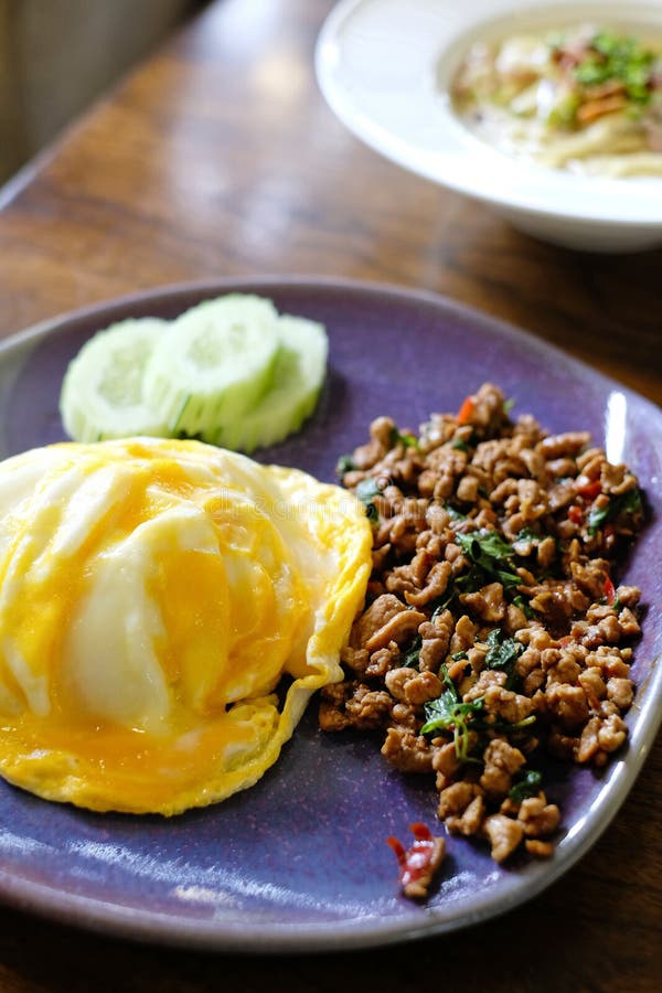 Spicy food, Stir fried rice, minced pork and basil topped with fried egg stock images Spicy food, Stir fried rice, minced pork and basil topped with fried egg stock images