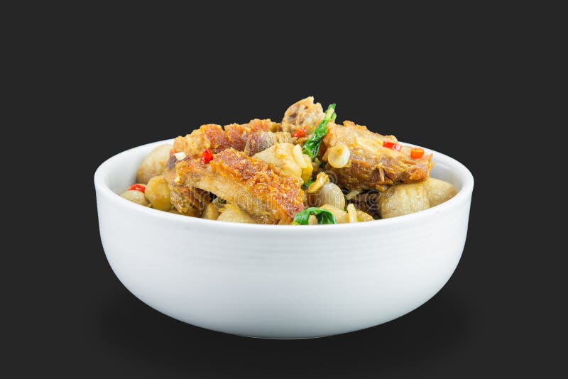 Spicy fried crispy pork with basil leaves stock photos Spicy fried crispy pork with basil leaves stock photos