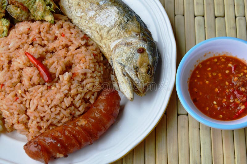 Spicy Fried Rice with Shrimp Paste Sauce and Mackerel on Plate Stock