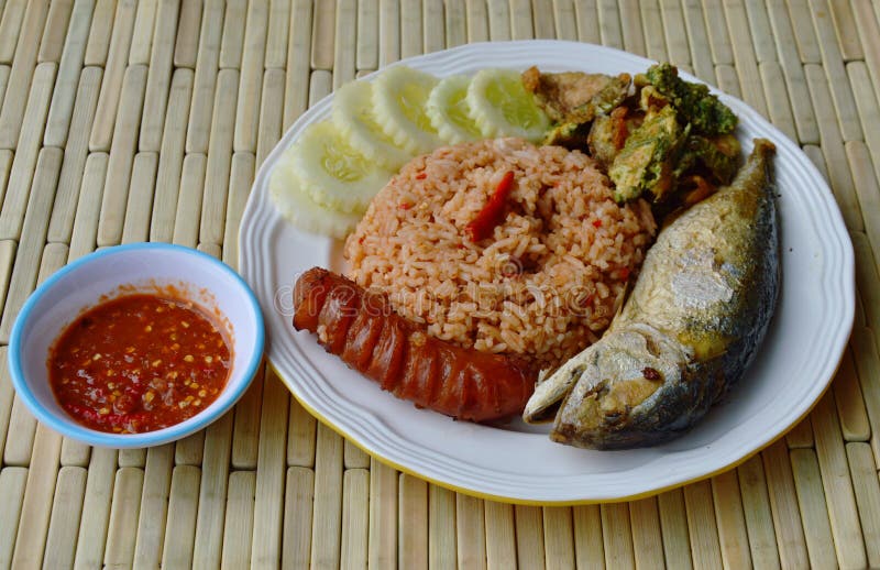 Spicy Fried Rice with Shrimp Paste Sauce and Mackerel on Plate Stock