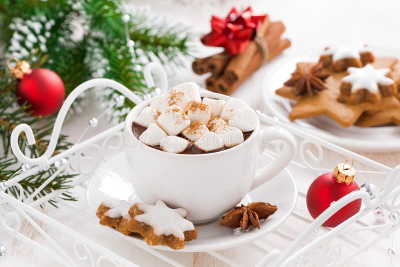 Spicy hot chocolate with marshmallows and Christmas decorations