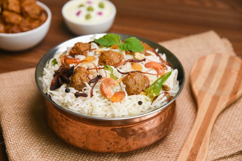Veg biryani or soya dum biryani ,Soya Chunks Pulao and raita. Basmati rice popular festival Lankan food Sri Lanka. Lankan food. Spicy Indian Malabar biriyani or Hydrabadi biryani, Dum Biriyani, pulao, pulav, pilaf, basmati rice, spicy mixed rice dish with meat curry for Ramadan Kareem, Eid Hyderabad India. Chicken dum biryani stock images, royalty-free photos and pictures