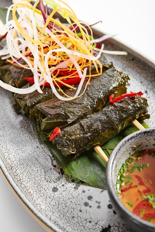 Spicy mutton with grape leaves stock photo Spicy mutton with grape leaves stock photo