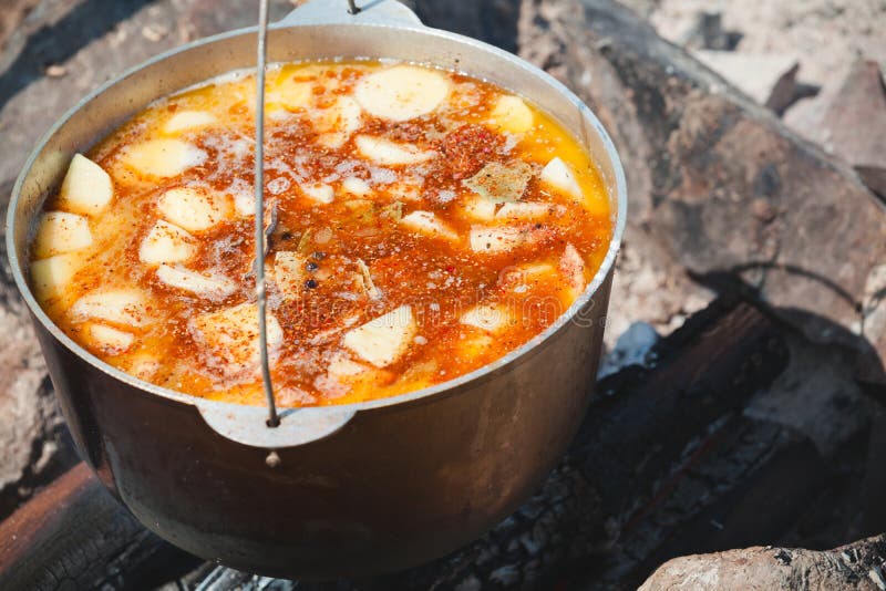 Big Cauldron Of Soup And Fish In Foil And Cooked On The Coals In The ...