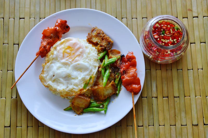 Spicy Stir Fried Crispy Pork Curry with Egg and Chili Fish Sauce Stock