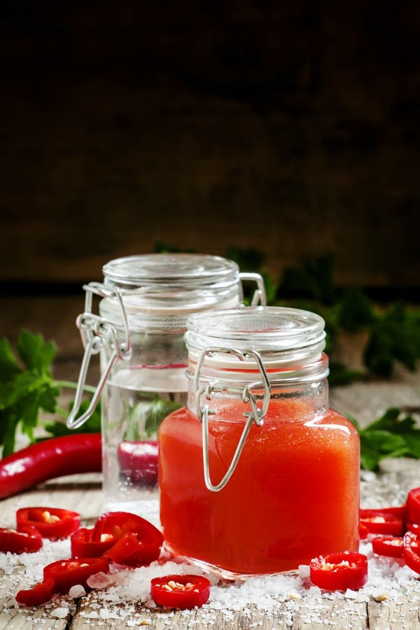 Spicy Tabasco sauce in a bottle, selective focus