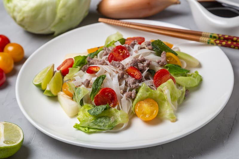 Spicy Thai Salad with Ground Beef and Rice Noodles. Yam Woon Sen Stock