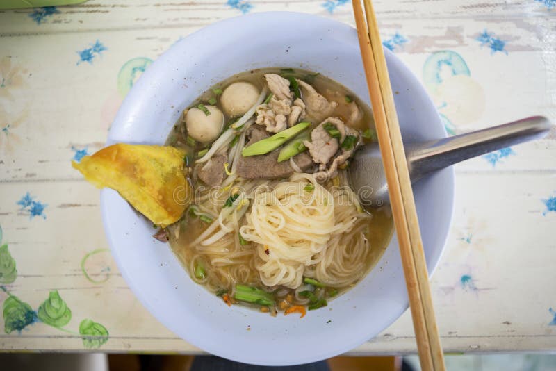 Spicy Tomyum noodle with pork and liver, Thai style noodle soup