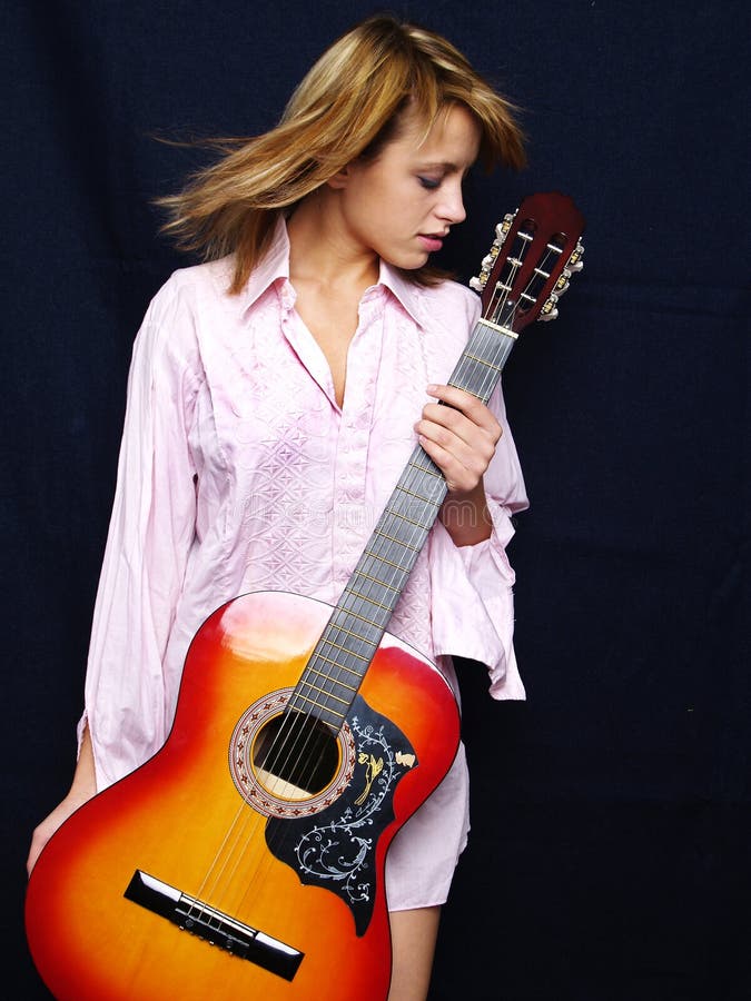 Beautiful young adult girl with guitar. Beautiful young adult girl with guitar